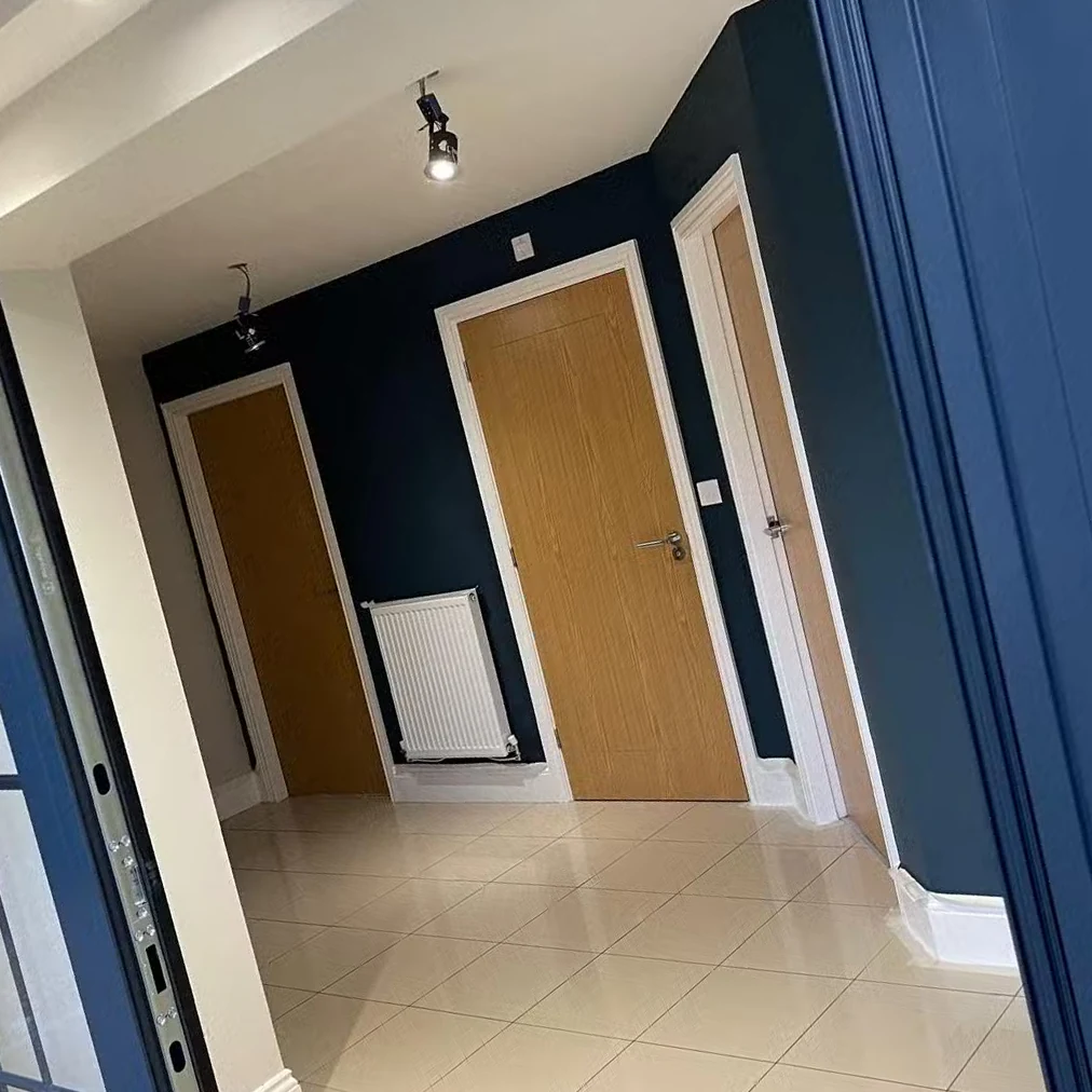 Dark entrance-hall feature walls professionally painted in Bradford by Bradford Decorators
